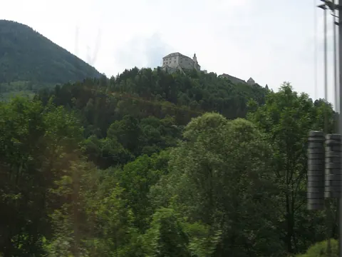 A hillside castle among trees, photographed with this camera