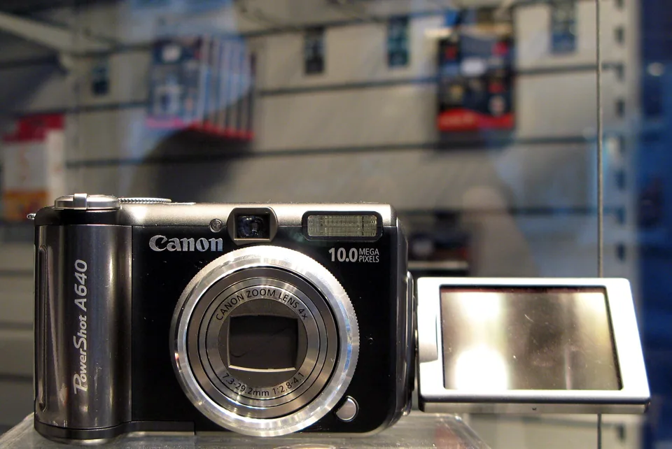 The Canon PowerShot A640 with its screen swung out from the body.
