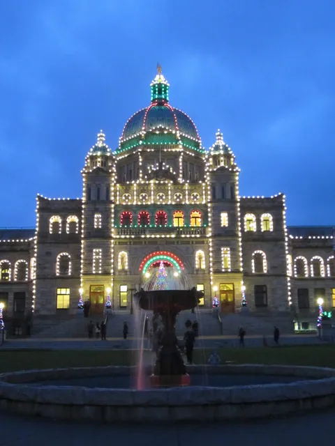 A provincial parliament lit at dusk