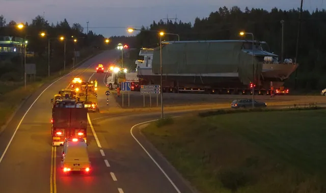 Heavy transport on a road at dusk