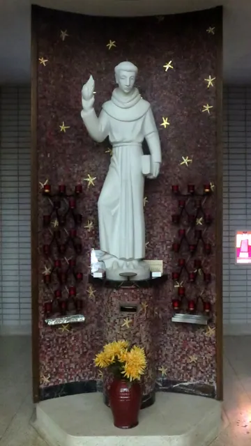 A statue in a dim church niche