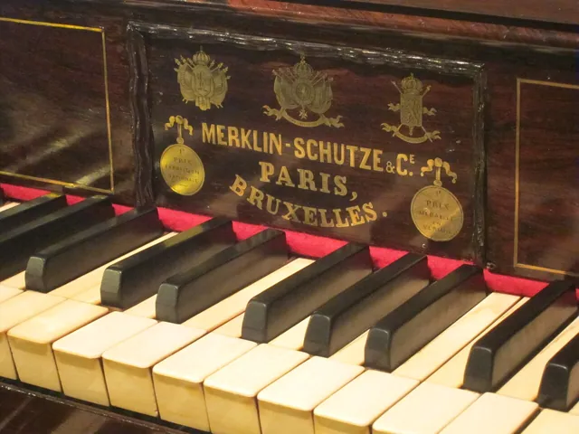 A nameplate on an old organ