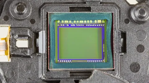 The CCD image sensor, photographed inside a dismantled IXUS 70.