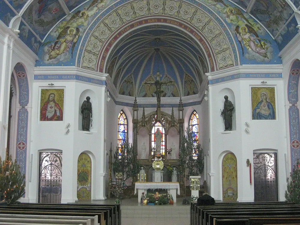 A painted church interior, handheld at ISO 800.