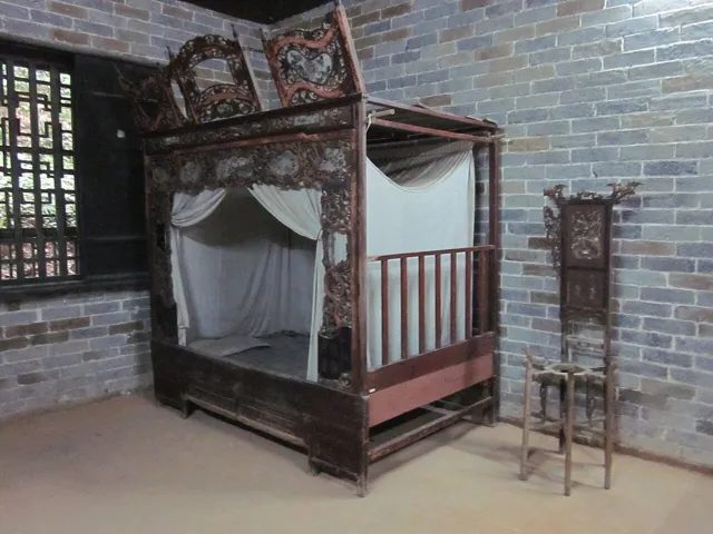 A carved bed in a historic house