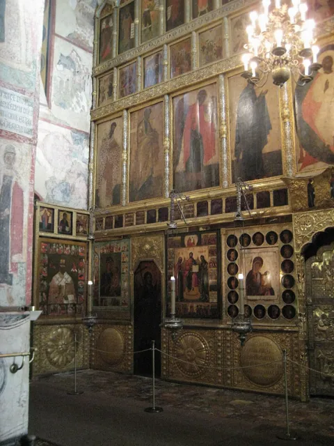 An iconostasis in a dim cathedral