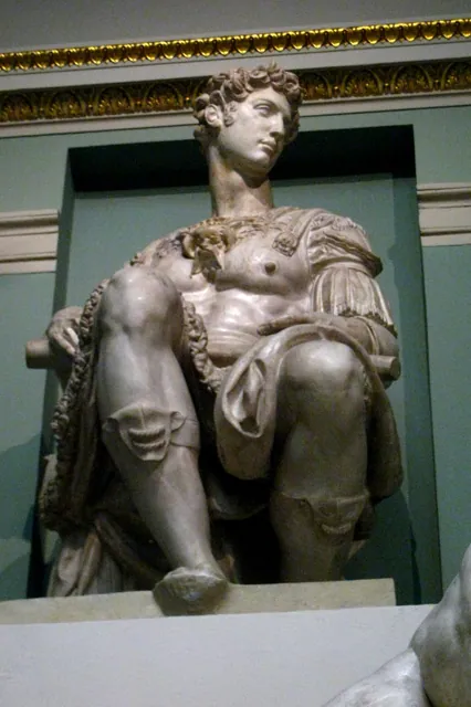 A cast of a tomb statue in a gallery