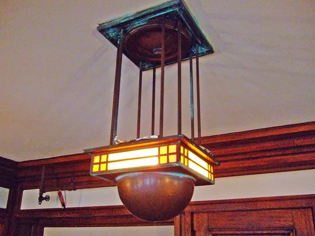 A ceiling lamp in a panelled room