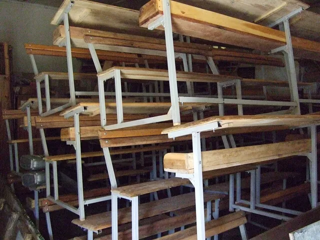 Stacked school furniture indoors