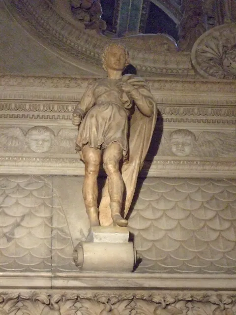 A statue in a dim church
