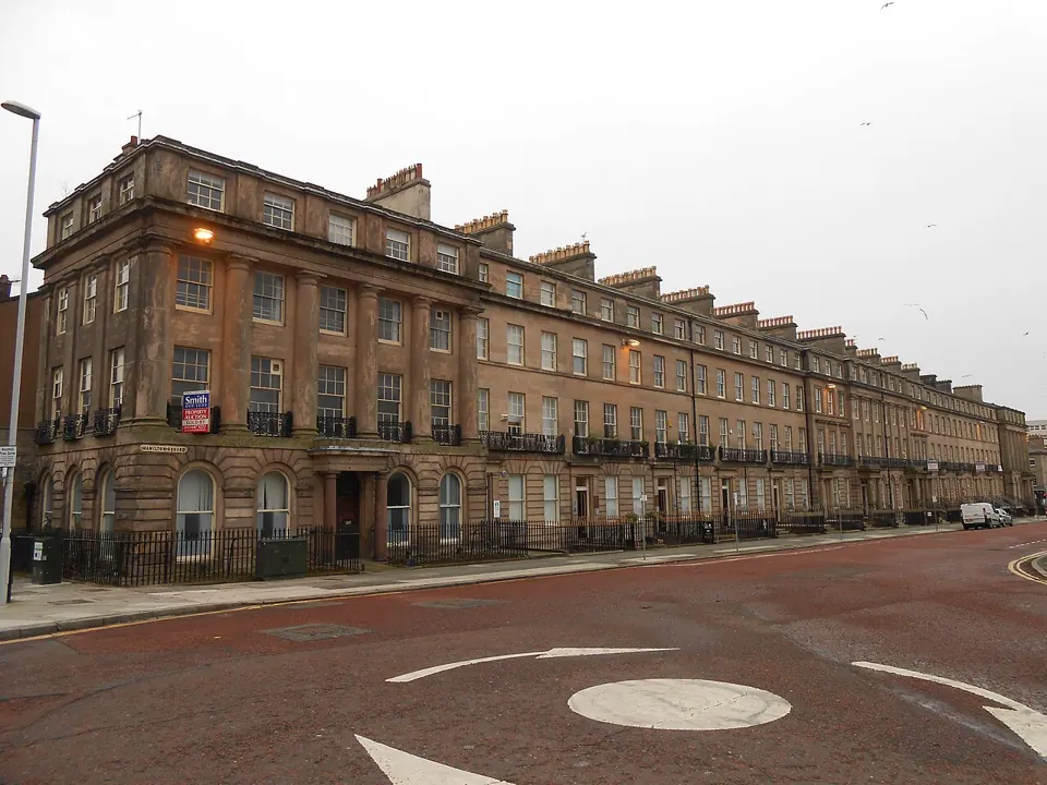 A terrace of buildings in Birkenhead, photographed with a Nikon Coolpix S3300. We found no free-licence photo of the camera itself.