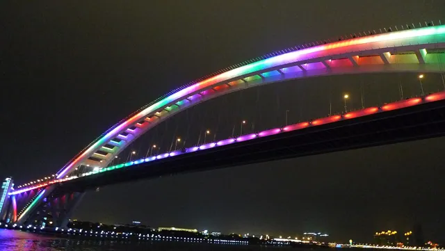 A lit bridge at night