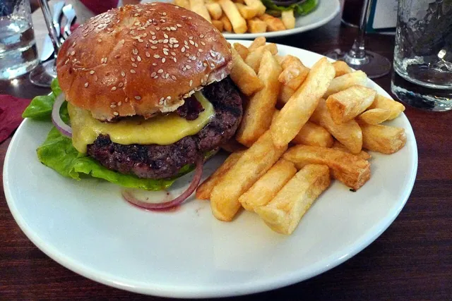A burger in restaurant light