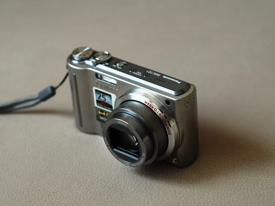 The Panasonic Lumix DMC-TZ7, sold in the US as the DMC-ZS3: silver front view.