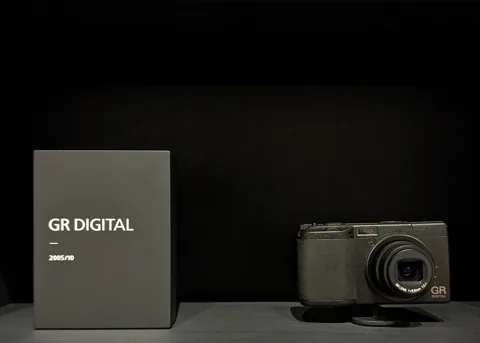 The GR Digital beside its box.