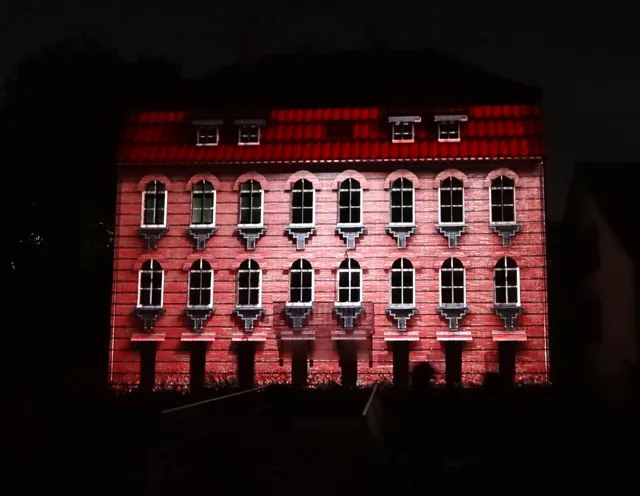 A building lit with projected colour