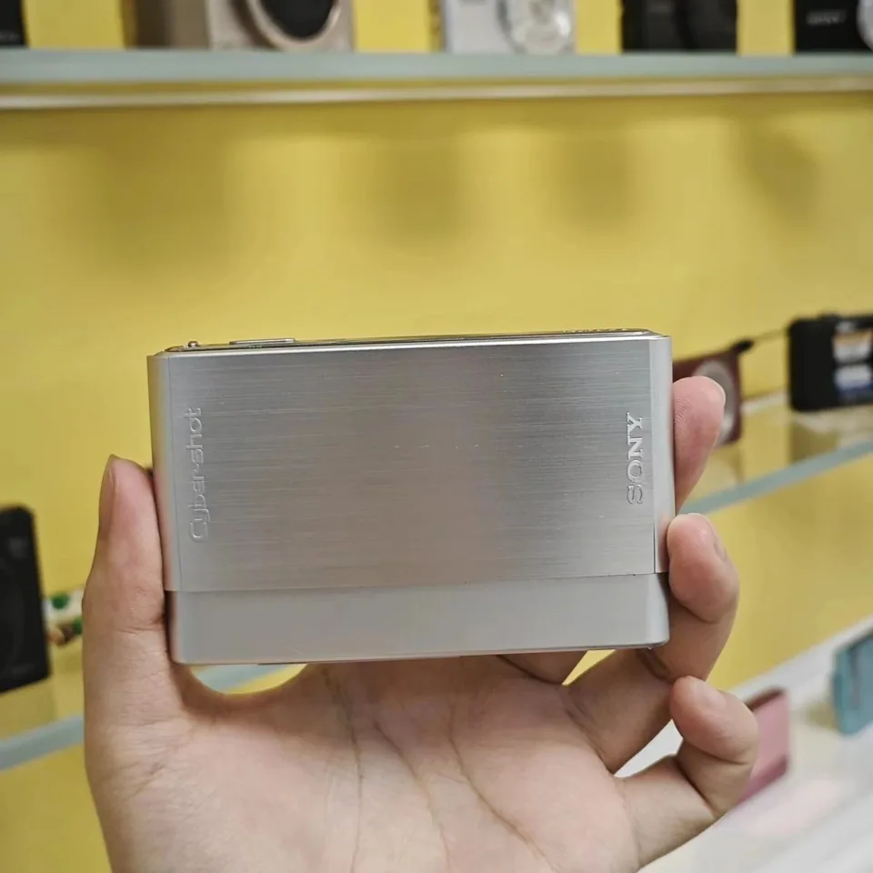 The brushed-metal slide cover of the Sony Cyber-shot DSC-T77, closed.
