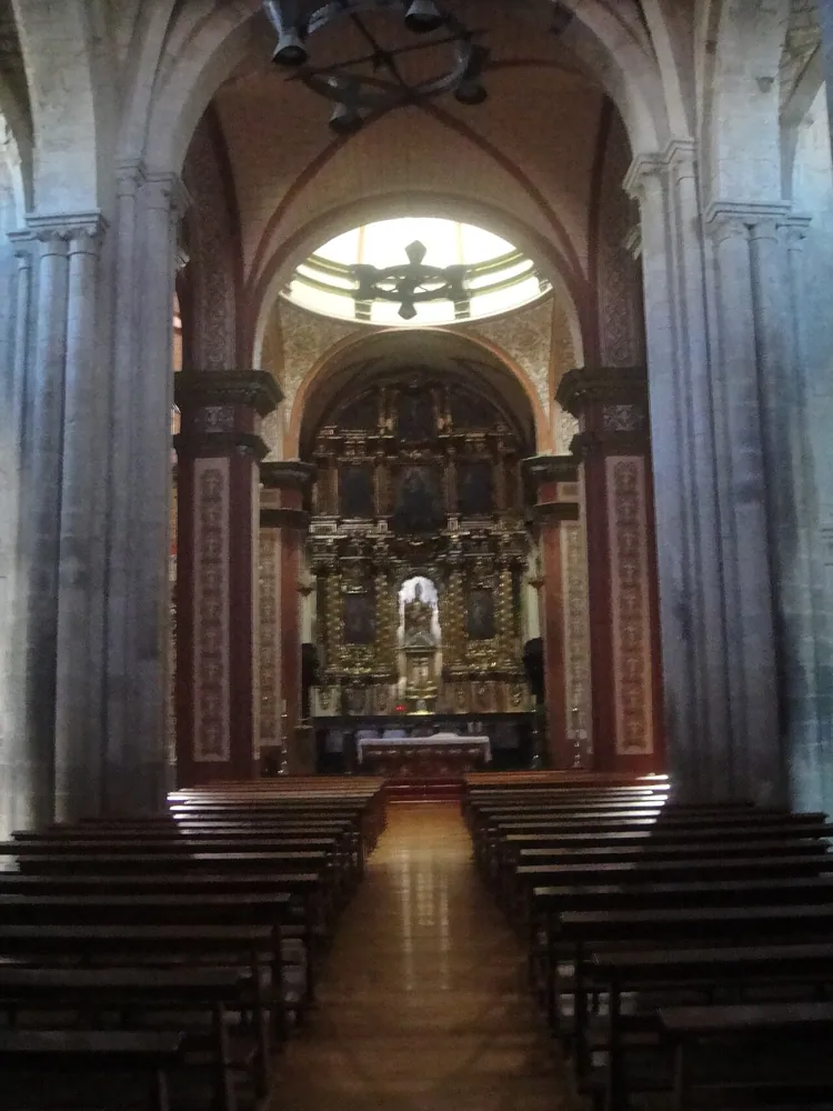 The nave of a church, handheld in available light.