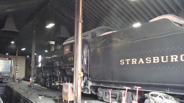 A steam locomotive in a shed