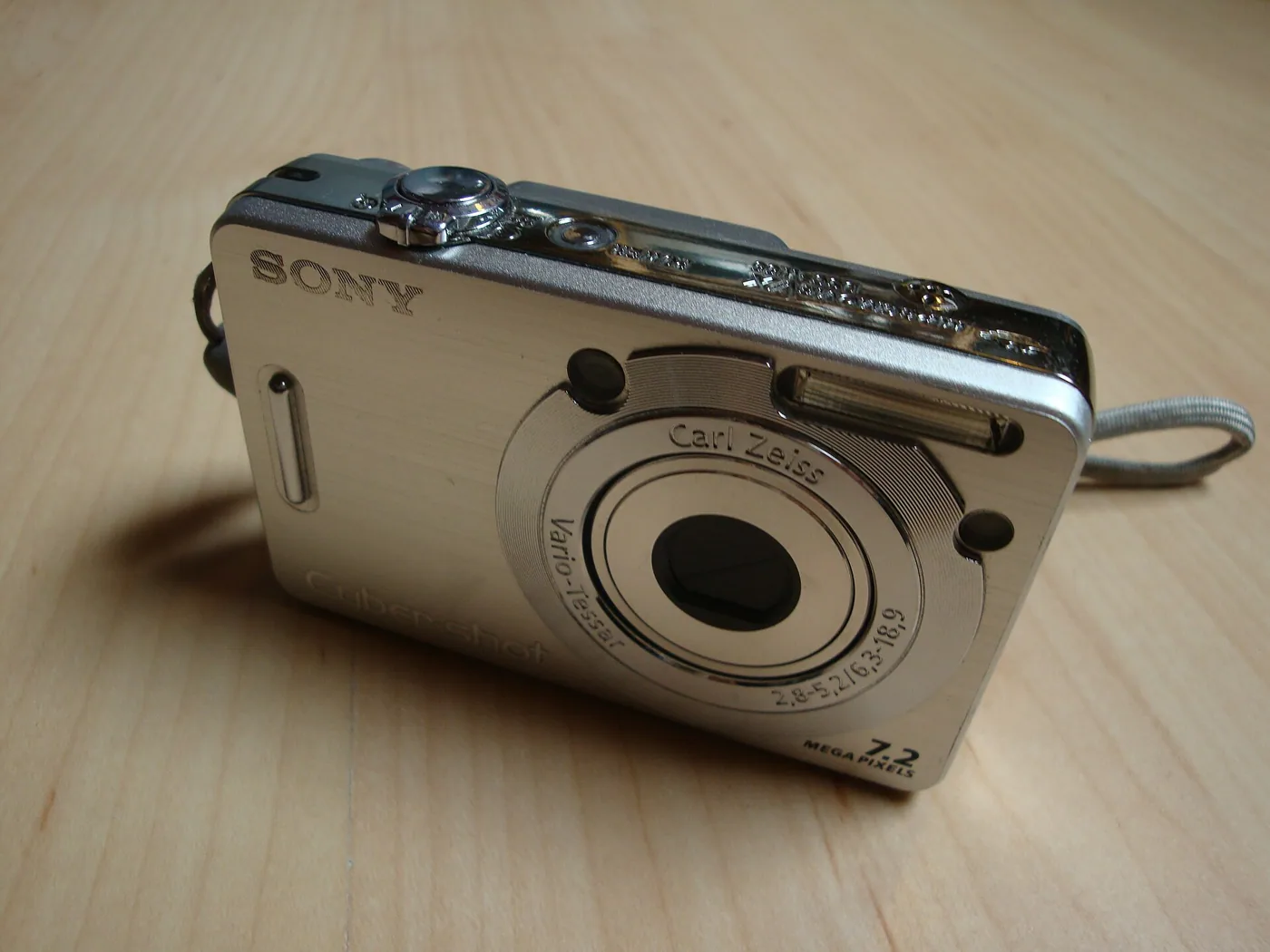 The Sony Cyber-shot DSC-W55 in silver, with its Carl Zeiss Vario-Tessar lens ring.