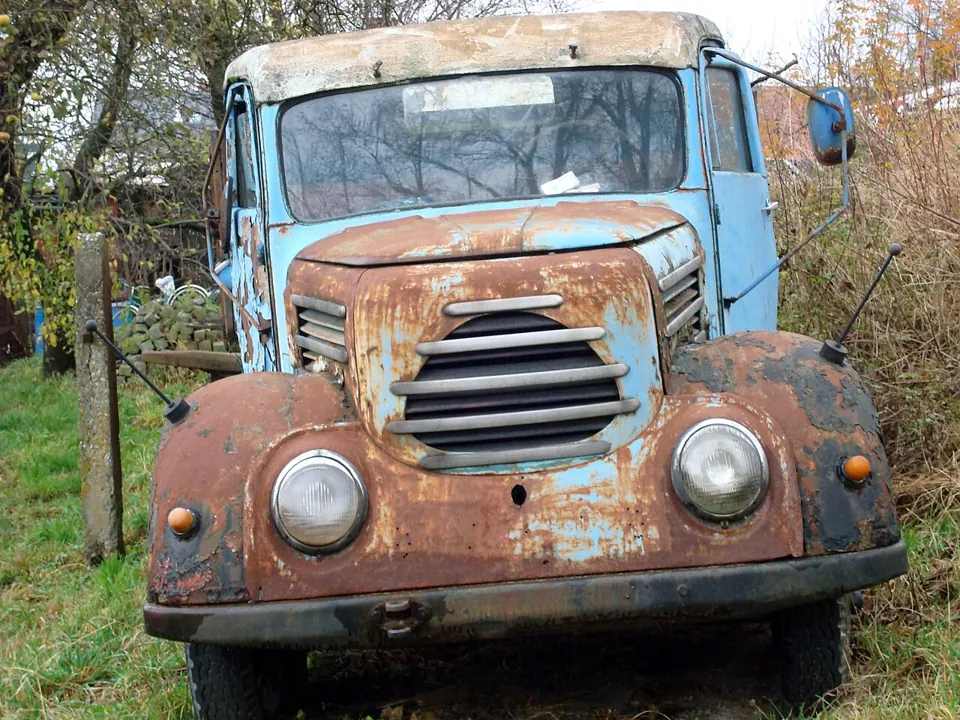 A rusty blue truck photographed with a Sony DSC-W80. We found no free-licence photo of a genuine W80, so we lead with a sample picture.