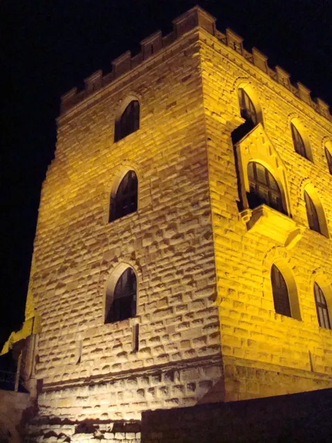A floodlit tower at night